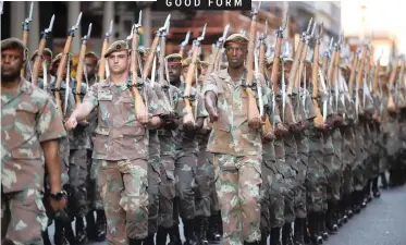 ?? | PHANDO JIKELO African News Agency (ANA) ?? MILITARY personnel marching down Plein Street in preparatio­n for the State of the Nation Address today.