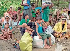  ??  ?? Rohingya Muslim refugees who had just arrived wait for a place to stay at Bangladesh's Balukhali refugee camp on October 2, 2017. AFP