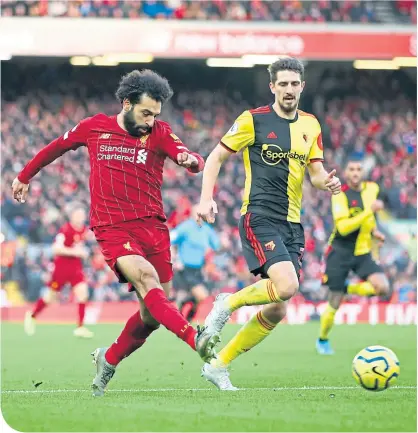  ??  ?? Star man Salah fires in another shot at Anfield yesterday as Liverpool extended their Premiershi­p lead