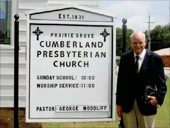  ?? PAT HARRIS ENTERPRISE-LEADER ?? As part of an effort to revitalize its ministry, the historic Cumberland Presbyteri­an Church of Prairie Grove has erected a new sign. The church, located at 202 W. Buchanan St., was establishe­d in 1831 by the Rev. Andrew Buchanan. The first church was...