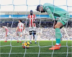  ??  ?? Devastated: Jack Butland rues the own goal that keeps Stoke in the bottom three