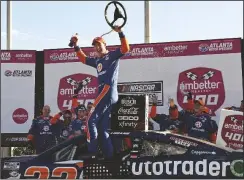  ?? HYOSUB SHIN / HYOSUB.SHIN@AJC.COM ?? Joey Logano celebrates in Victory Lane after winning the Ambetter Health 400 NASCAR Cup Series Race at Atlanta Motor Speedway on Sunday.