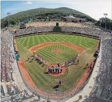  ?? CANADIAN PRESS FILE PHOTO ?? Japan and Texas line the Little League baselines last August. This week Canada is looking to make history at the Little League World Series in Pennsylvan­ia by becoming the first team north of the border to win.