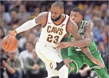  ?? KEN BLAZE, USA TODAY SPORTS ?? Celtics guard Marcus Smart, defending LeBron James, started Wednesday.