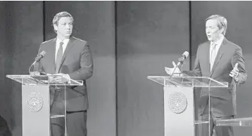  ?? JOHN RAOUX/AP ?? Republican gubernator­ial candidate Ron DeSantis, left, who was endorsed by President Trump, listens as Adam Putnam.