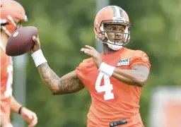  ?? NICK CAMMETT/AP ?? Browns quarterbac­k Deshaun Watson, who was suspended for six games, throws a pass during the training camp on Monday in Berea, Ohio.