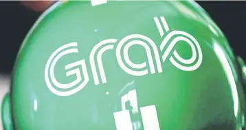  ??  ?? Grab, which is transformi­ng itself into a consumer technology group, already offers loans, electronic money transfers, payments and food delivery. With the launch of GrabFresh, it will now provide on-demand grocery delivery. — Reuters photo