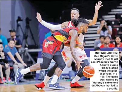  ??  ?? INTENSE ACTION: San Miguel’s Kevin Murphy tries to get past Phoenix’s Calvin Abueva during Friday’s game which the Beermen won, 117100. The game was marred by Murphy’s chokehold on Abueva that led to a scuffle.