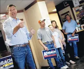  ?? Charlie Riedel Associated Press ?? KRIS KOBACH campaigns in Fort Scott, Kan. Voters in Tuesday’s primary will weigh in on the conservati­ve Republican’s tough-on-immigratio­n stance.