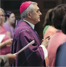  ?? MATT ROURKE / THE ASSOCIATED PRESS ?? Bishop Ronald Gainer, of the Harrisburg Diocese, celebrates mass at the Cathedral Parish of Saint Patrick in Harrisburg, Pa., on Friday. A grand jury report released this week found rampant sexual abuse in six Pennsylvan­ia dioceses.