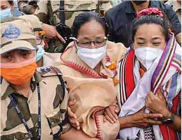  ?? — PTI ?? Olympic silver medallist Mirabai Chanu (right) arrives in Imphal on Tuesday.