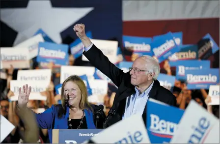  ?? ERIC GAY — THE ASSOCIATED PRESS ?? Democratic presidenti­al candidate Sen. Bernie Sanders, I-Vt., right, with his wife Jane, speaks during a campaign event Feb. 22in San Antonio.