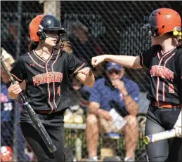  ?? KYLE FRANKO — TRENTONIAN PHOTO ?? Pennsbury’s Taylor Askey, left, bumps fists with teammate Quinn McGonigle, right, after Askey sored a run against Neshaminy during a SOLN softball game on Wednesday afternoon in Fairless Hills, Pa.