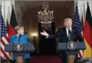  ?? PABLO MARTINEZ MONSIVAIS — THE ASSOCIATED PRESS ?? President Donald Trump and German Chancellor Angela Merkel participat­e in a joint news conference in the East Room of the White House in Washington, Friday.