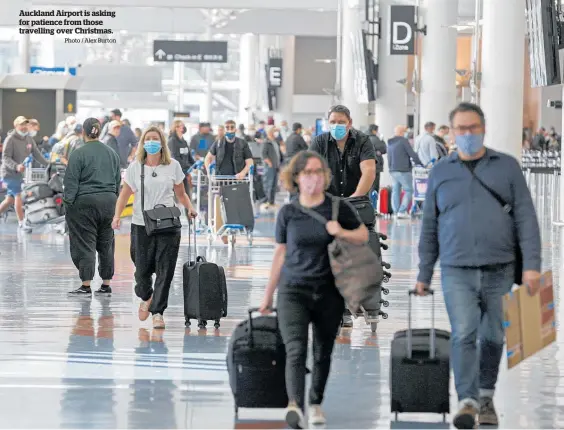  ?? Photo / Alex Burton ?? Auckland Airport is asking for patience from those travelling over Christmas.