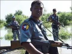  ?? YE AUNG THU/AFP ?? Armed Myanmar border guards patrol the area along the river dividing Myanmar and Bangladesh located in Maungdaw, Rakhine state, on October 18.