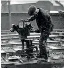  ??  ?? This 1960s picture of the Foyle Road ground signal light having its oil topped up is one of many now being handed in to the museum, which is certain that many more exist and wants to see them. FVRM