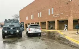  ?? GAVIN GOOD/PIONEER PRESS ?? An armored police vehicle sits outside Highland Park High School on April 4 after it was put on lockdown in connection with reports of a student bringing a gun to the campus.