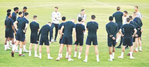  ??  ?? England’s manager Gareth Southgate (second right) talks to his players during a training session at the Ciudad Deportiva Luis del Sol in Sevilla on the eve of the UEFA Nations League football match between Spain and England. — AFP photo