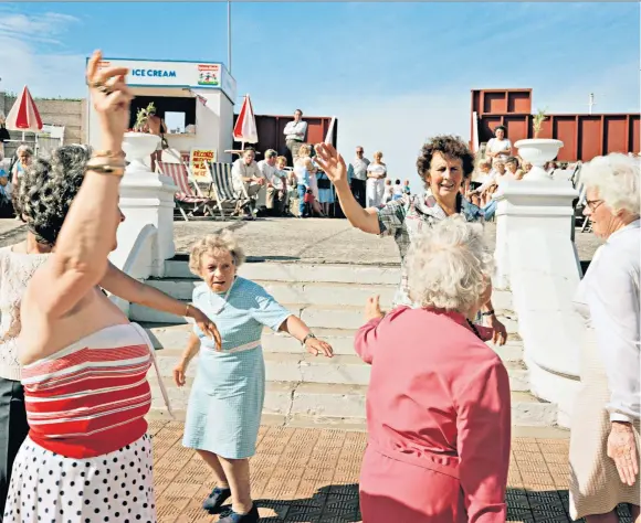  ?? ?? g ‘On Margate Sands./
I can connect/ Nothing with nothing’: Martin Parr's 1986 photograph of Margate seafront; far left, TS Eliot in 1951
The full-colour facsimile of ‘The Waste Land’ (Faber, £25) is out on Thursday