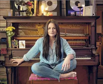  ?? Photos by Mark Humphrey / Associated Press ?? Gena Johnson poses in her home studio in Nashville, Tenn.