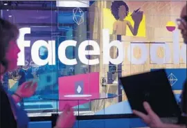  ?? Noah Berger Associated Press ?? THE SOCIAL networking giant’s risk assessment measures include monitoring which users have a propensity to f lag content published by others as problemati­c.