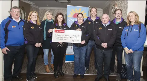  ??  ?? Organisers of the Lough Gill Swim presenting a cheque for €38,000 to Mary Forte of the Northwest Hospice. This was the highest amount ever raised by the event which is organised in memory of Neil McGarry. Pic: Donal Hackett.