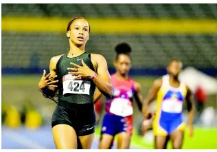  ?? PHOTO EDITOR GLADSTONE TAYLOR/MULTIMEDIA ?? Briana Williams wins her heat in the Girls’ 17-19 100m dash with a flash time of 11.53 seconds, on day one of the Carifta Trials on Friday.