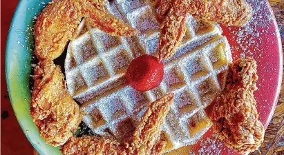  ?? Houston Chronicle file ?? Fried chicken and waffle is one of the most popular dishes at The Breakfast Klub in Houston.