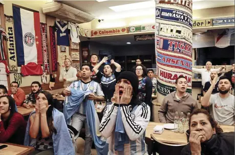  ??  ?? National disaster: Argentinia­n supporters in Buenos Aires react in dejection after losing the Copa America final to Chile.