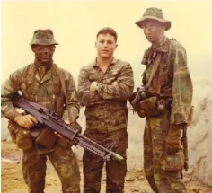  ??  ?? Top: John Blake, left, circa 1970–71, stands in Vietnam with friends and fellow soldiers Michael Swisley, centre, and Charlie Cash, right.