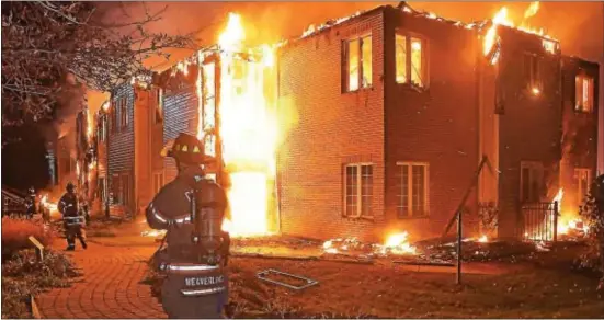  ?? PETE BANNAN – DIGITAL FIRST MEDIA ?? Firefighte­rs battle a blaze at the Barclay Friends Home in West Chester late at night on Nov. 16. Dozens of residents were evacuated after the inferno roared through the structure.