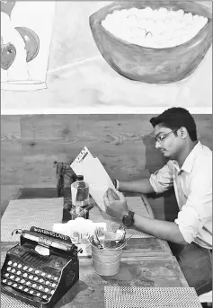  ??  ?? Typewriter mechanic Anand Savarkar checks the keys of an old typewriter at his repair shop in Mumbai.