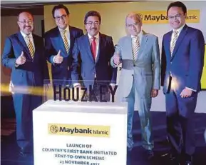  ?? PIC BY ZULFADHLI ZULKIFLI ?? (From left) Maybank Islamic Bhd chief executive officer (CEO) Datuk Mohamed Rafique Merican, Maybank group president and CEO Datuk Abdul Farid Alias, Second Finance Minister Datuk Seri Johari Abdul Ghani, Maybank Islamic chairman Zainal Abidin Jamal...