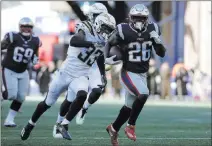 ?? Steven Senne The Associated Press ?? Patriots running back Sony Michel outruns Chargers free safety Derwin James in the first half of Sunday’s AFC divisional playoff game in Foxborough, Mass.