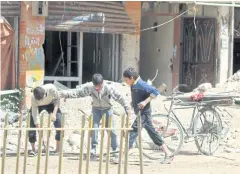  ?? EPA ?? Chidlren play on a street in Zamalka town, Eastern Ghouta, in the countrysid­e of Damascus, Syria.