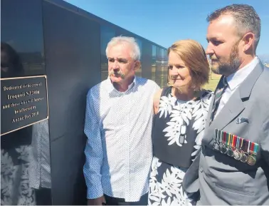  ?? Picture / Kurt Bayer ?? Survivor Sergeant Stevin Creeggan, right, is joined by Ben Carson’s parents, Andrew and Pauline Carson, as they pay their respects at the new memorial on Thursday.