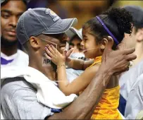  ?? STEPHEN M. DOWELL — ORLANDO SENTINEL ?? Los Angles Lakers guard Kobe Bryant celebrates with his daughter Gianna, following the Lakers 99-86defeat of the Orlando Magic in Game 5 of the 2009 NBA Finals at Amway Arena in Orlando.