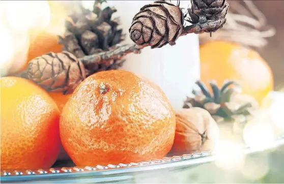  ?? [PHOTOS PROVIDED] ?? OMRF researcher­s suggest adding fresh fruit to your stockings this year. It’s not only healthy, it’s a long-held tradition.