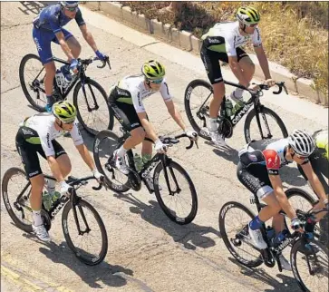  ?? Photograph­s by Al Seib Los Angeles Times ?? THREE MEMBERS of Team Dimension Data, wearing white jerseys, cruise along in the pack in Ventura during the Amgen Tour of California. The team is in 15th place after Wednesday’s time trial.