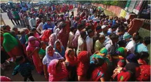  ??  ?? Voters stand in queues outside a polling station during the final phase of general election in Chandigarh, yesterday.