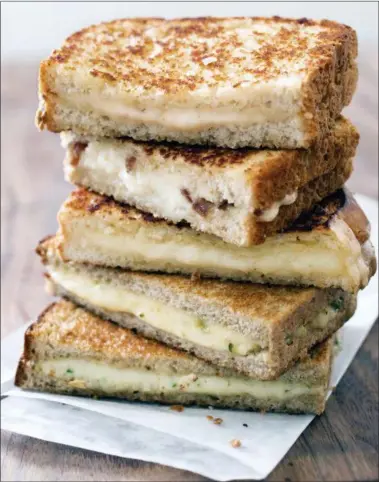  ?? CARL TREMBLAY — AMERICA’S TEST KITCHEN VIA AP ?? Grown-Up Grilled Cheese with Cheddar and Shallot