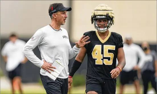  ?? GERALD HERBERT/ASSOCIATED PRESS ?? Saints first-year coach Dennis Allen talks with linebacker Nephi Sewell during training camp in July. Allen, who also coached the Raiders in 2012-14, is one of five new coaches getting a second chance to lead a team this season. Allen, who was fired after starting 0-4 in 2014, went 8-28 with Oakland