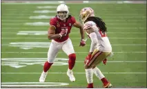  ?? JENNIFER STEWART — THE ASSOCIATED PRESS ?? Arizona Cardinals wide receiver Larry Fitzgerald (11) runs a route action against San Francisco 49ers cornerback Jason Verrett (22) on Saturday in Glendale, Ariz.