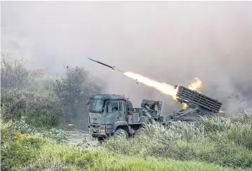  ?? BLOOMBERG ?? A Thunderbol­t 2000 multiple rocket launcher fires munitions during the Republic of China Armed Forces’ annual Han Kuang military exercise in Taichung, Taiwan.