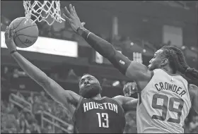  ?? Associated Press ?? To the basket: Houston Rockets guard James Harden (13) drives to the basket as Utah Jazz forward Jae Crowder defends during the first half in Game 1 of an NBA basketball second-round playoff series Sunday in Houston.