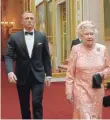  ?? LONDON ORGANISING COMMITTEE OF THE OLYMPIC AND PARALYMPIC GAMES VIA AFP/GETTY IMAGES ?? The queen’s appearance with “James Bond” in a video for the 2012 Olympics in London symbolized the new, more relatable royal family.