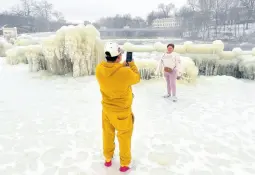  ?? AP PHOTOS ?? Mist from the Great Falls has created a frozen wonderland around the waterfalls in Paterson, New Jersey.