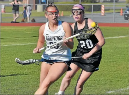  ?? STAN HUDY - SHUDY@DIGITALFIR­STMEDIA.COM ?? Saratoga’s Katie Wendell (23) looks to get control of the ball after beating Shenendeho­wa’s Bridget Shanahan (20) after securing the ground ball during Monday’s Section II Class A semifinal at Saratoga Springs High School.