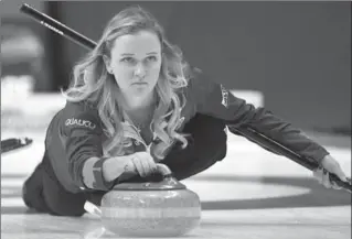  ?? JUSTIN TANG, THE CANADIAN PRESS ?? Skip Chelsea Carey of Calgary throws a rock in a 10-3 victory against Team Englot on Friday, improving to 8-0.